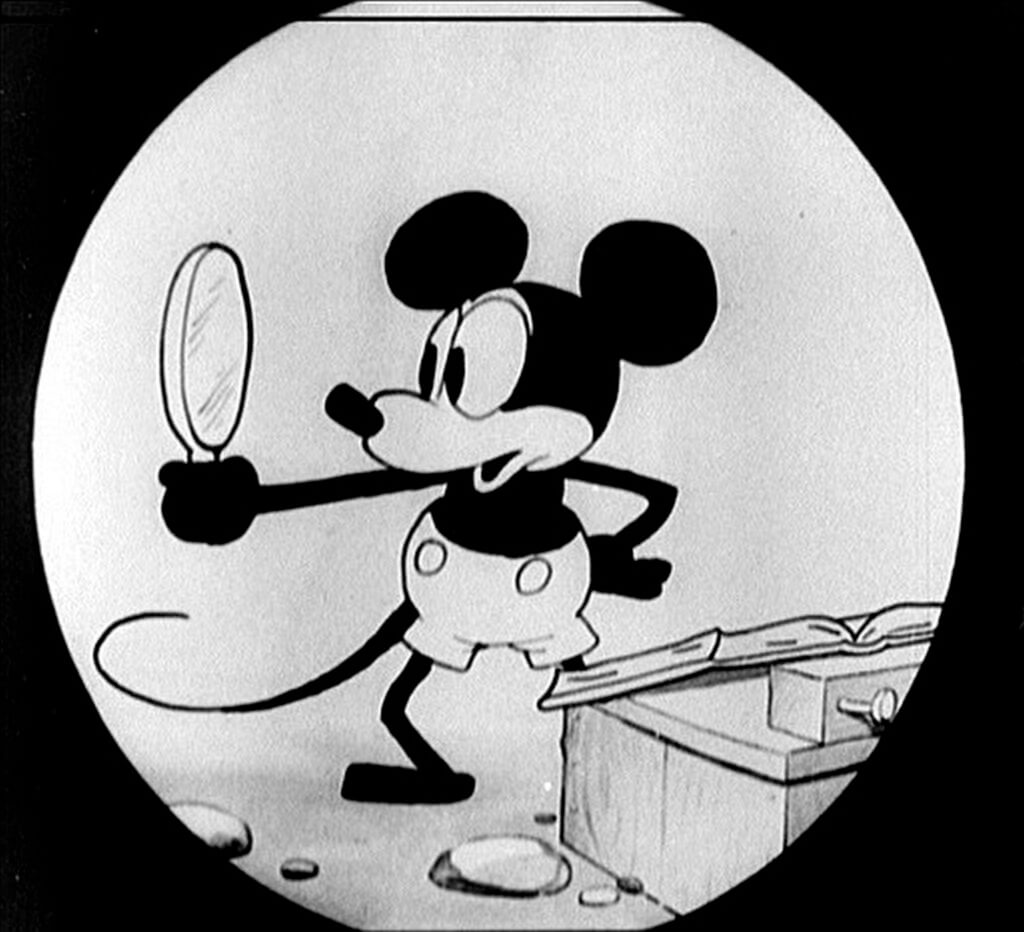 1928年のアニメーション映画『プレーン クレイジー』からの初期のミッキーマウスのイラスト。このミッキーは、後のバージョンとは異なる目のデザインを持っている